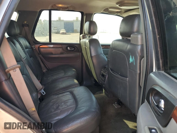 2003 GMC Envoy SLE with VIN 1GKDS13S332390989, listed as a Copart auction lot 74729104 with 127,680 mi miles and Salvage Title. Bid and sale history available at DreamBid. Image 11.