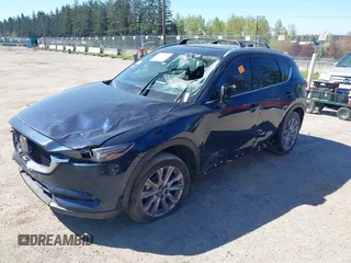 2020 Mazda CX-5 Grand Touring with VIN JM3KFBDM7L0724005, listed as a IAAI auction lot 42034658 with 90,631 mi miles. Bid and sale history available at carsss.com. Image 2.