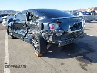 2015 Scion tC with VIN JTKJF5C79FJ003404, listed as a IAAI auction lot 41756024 with 128,906 mi miles. Bid and sale history available at carsss.com. Image 3.