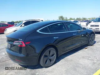 2019 Tesla Model 3 Mid Range with VIN 5YJ3E1EA0KF317058, listed as a IAAI auction lot 42025195 with 108,771 mi miles. Bid and sale history available at carsss.com. Image 4.