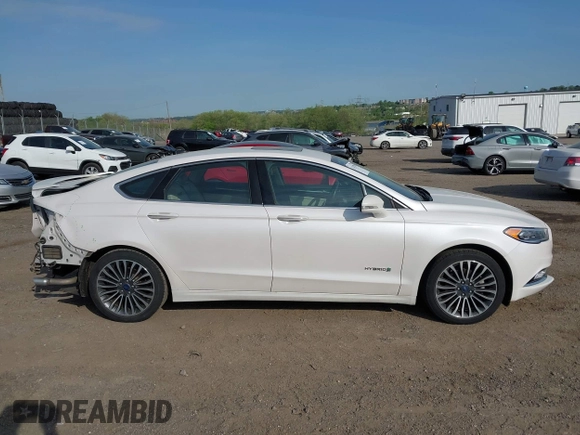 2017 Ford Fusion Hybrid Titanium с VIN 3FA6P0RU7HR148191, выставлен на аукционе IAAI как лот 42167708 с пробегом 72 708 миль миль и . История ставок и продаж доступна на DreamBid. Изображение 14.