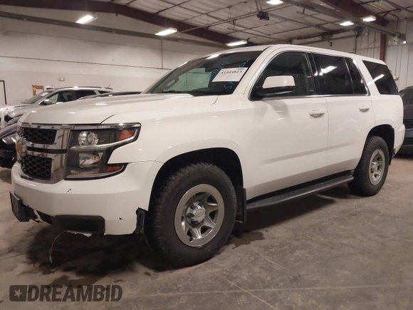 2015 Chevrolet Tahoe Commercial with VIN 1GNSK2EC5FR688820, listed as a IAAI auction lot 41444813 with 206,244 mi miles and . Bid and sale history available at DreamBid. Image 2.