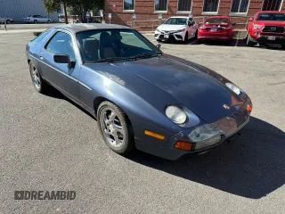 1987 Porsche 928 z VIN WP0JB0921HS862257, wystawiony jako Copart lot #76322184 z przebiegiem 159 733 mil mil oraz Tytuł czysty. Historia ofert i sprzedaży dostępna na DreamBid. Obrazek 1.