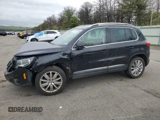 2014 Volkswagen Tiguan S z VIN WVGBV3AX5EW554500, wystawiony jako Copart lot #57016775 z przebiegiem 91 101 mil mil oraz Szkoda całkowita • Salvage title. Historia ofert i sprzedaży dostępna na DreamBid. Obrazek 1.