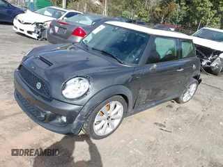 2013 MINI Hardtop S with VIN WMWSV3C50DT394345, listed as a IAAI auction lot 41738216 with 58,241 mi miles and . Bid and sale history available at DreamBid. Image 2.