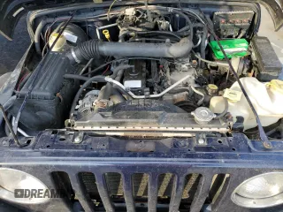 2006 Jeep Wrangler Sport Right Hand Drive with VIN 1J4F449S16P741407, listed as a Copart auction lot 88804015 with 182,059 mi miles and Salvage Title. Bid and sale history available at carsss.com. Image 12.