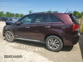 2012 Kia Sorento SX z VIN 5XYKWDA29CG301363, wystawiony jako Copart lot #55954815 z przebiegiem 83 206 mil mil oraz Szkoda całkowita • Salvage title. Historia ofert i sprzedaży dostępna na DreamBid. Obrazek 2.