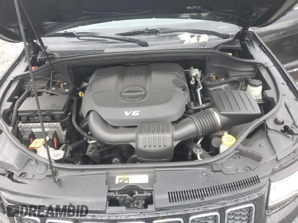 2014 Jeep Grand Cherokee Overland with VIN 1C4RJFCG1EC587458, listed as a Copart auction lot 50213015 with 124,266 mi miles and Salvage Title. Bid and sale history available at carsss.com. Image 12.
