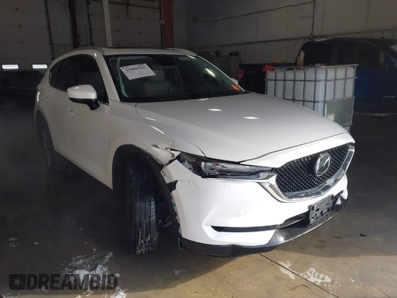 2021 Mazda CX-5 Grand Touring with VIN JM3KFADM3M0312143, listed as a IAAI auction lot 41606582 with 46,515 mi miles. Bid and sale history available at carsss.com. Image 1.
