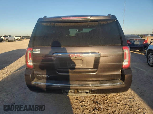 2015 GMC Yukon Denali with VIN 1GKS1CKJ7FR132677, listed as a Copart auction lot 82118584 with 144,798 mi miles and Salvage Title. Bid and sale history available at carsss.com. Image 6.