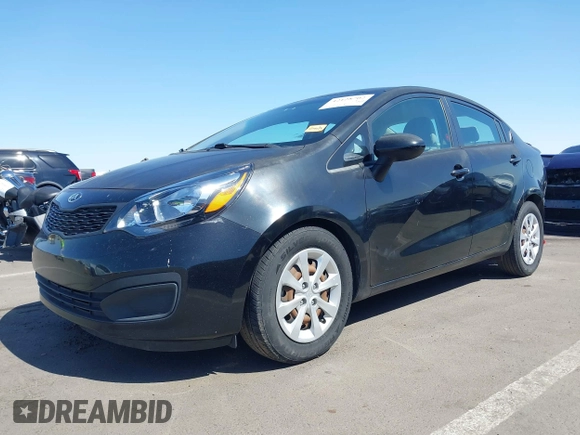 2014 Kia Rio LX with VIN KNADM4A39E6364490, listed as a IAAI auction lot 42128702 with 130,981 mi miles and . Bid and sale history available at DreamBid. Image 2.