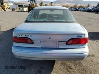 1993 Ford Taurus z VIN 1FACP5216PG197713, wystawiony jako Copart lot #80982424 z przebiegiem 79 330 mil mil oraz Szkoda całkowita • Salvage title. Historia ofert i sprzedaży dostępna na DreamBid. Obrazek 6.