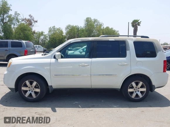 2013 Honda Pilot Touring with VIN 5FNYF3H93DB017954, listed as a IAAI auction lot 42185556 with 174,929 mi miles and . Bid and sale history available at carsss.com. Image 14.