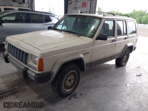1996 Jeep Cherokee Country z VIN 1J4FT78S0TL280645, wystawiony jako IAAI lot #42340813 z przebiegiem 288 418 mil mil oraz . Historia ofert i sprzedaży dostępna na DreamBid. Obrazek 2.