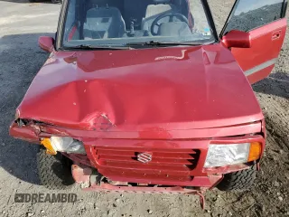 1995 Suzuki Sidekick z VIN JS3TD03V6S4113425, wystawiony jako Copart lot #76973244 z przebiegiem 152 638 mil mil oraz Szkody całkowita. Historia ofert i sprzedaży dostępna na DreamBid. Obrazek 11.