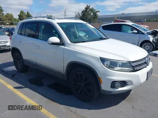 2014 Volkswagen Tiguan SE with VIN WVGAV3AX9EW551918, listed as a IAAI auction lot 42844945 with 169,703 mi miles and . Bid and sale history available at DreamBid. Image 1.