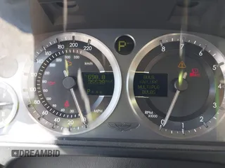 2005 Aston Martin DB9 z VIN SCFAD01A75GA01262, wystawiony jako IAAI lot #41937486 z przebiegiem 35 538 mil mil oraz . Historia ofert i sprzedaży dostępna na DreamBid. Obrazek 7.