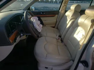 1998 Lincoln Continental with VIN 1LNFM97V3WY647762, listed as a Copart auction lot 77062294 with 153,553 mi miles and Salvage Title. Bid and sale history available at carsss.com. Image 7.