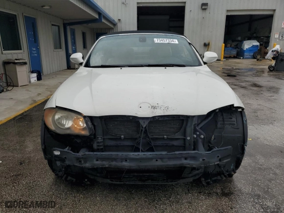 2011 BMW 1 Series 128i with VIN WBAUN1C5XBVH82605, listed as a Copart auction lot 73457334 with 94,969 mi miles and Salvage Title. Bid and sale history available at carsss.com. Image 5.