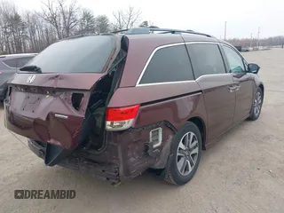 2014 Honda Odyssey Touring with VIN 5FNRL5H97EB117971, listed as a IAAI auction lot 41794324 with 198,191 mi miles and . Bid and sale history available at DreamBid. Image 4.