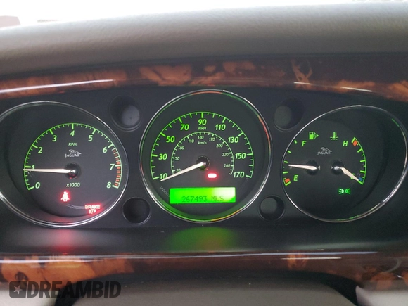 2004 Jaguar XJ with VIN SAJWA71C14SG16264, listed as a Copart auction lot 83251554 with 267,493 mi miles and Salvage Title. Bid and sale history available at carsss.com. Image 9.