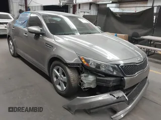 2014 Kia Optima LX with VIN 5XXGM4A71EG325297, listed as a IAAI auction lot 41748983 with 74,604 mi miles and . Bid and sale history available at carsss.com. Image 1.