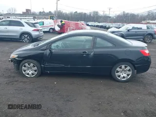 2010 Honda Civic Cpe LX with VIN 2HGFG1B65AH506256, listed as a IAAI auction lot 41942862 with 142,683 mi miles. Bid and sale history available at carsss.com. Image 14.