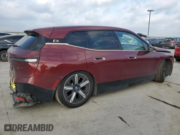 2023 BMW iX xDrive50 with VIN WB523CF01PCM76013, listed as a Copart auction lot 48326965 with 18,923 mi miles and Salvage Title. Bid and sale history available at carsss.com. Image 3.