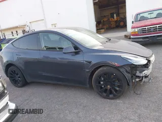 2023 Tesla Model Y Long Range with VIN 7SAYGDEE1PA053683, listed as a IAAI auction lot 42124517 with 32,295 mi miles. Bid and sale history available at carsss.com. Image 12.