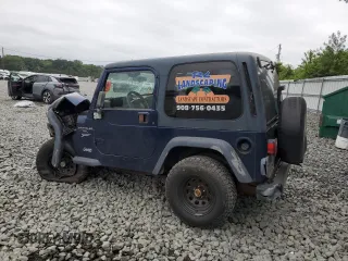 2001 Jeep Wrangler Sport with VIN 1J4FA49S01P363856, listed as a Copart auction lot 62494785 with 154,782 mi miles and Salvage title. Bid and sale history available at DreamBid. Image 2.