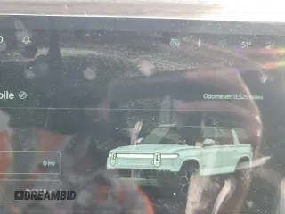 2023 Rivian R1S Adventure z VIN 7PDSGABAXPN019516, wystawiony jako Copart lot #73248104 z przebiegiem 11 525 mil mil oraz Szkody całkowita. Historia ofert i sprzedaży dostępna na DreamBid. Obrazek 9.