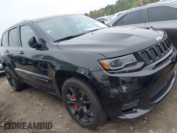 2017 Jeep Grand Cherokee SRT z VIN 1C4RJFDJ7HC683240, wystawiony jako IAAI lot #41919995 z przebiegiem 122 030 mil mil oraz . Historia ofert i sprzedaży dostępna na DreamBid. Obrazek 1.