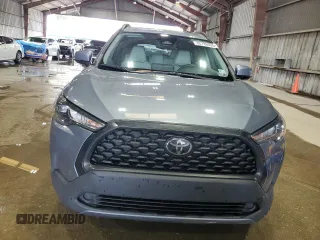 2023 Toyota Corolla Cross LE z VIN 7MUBAAAG4PV042580, wystawiony jako Copart lot #60788025 z przebiegiem 59 576 mil mil oraz Szkoda całkowita • Salvage title. Historia ofert i sprzedaży dostępna na DreamBid. Obrazek 5.