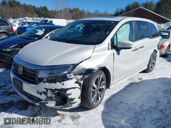 2023 Honda Odyssey Touring with VIN 5FNRL6H81PB008129, listed as a IAAI auction lot 41610714 with 57,273 mi miles and . Bid and sale history available at DreamBid. Image 2.
