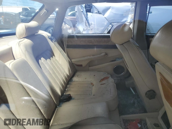 1990 Jaguar XJ with VIN SAJKY1745LC622713, listed as a Copart auction lot 56545414 with Not Provided miles and Salvage Title. Bid and sale history available at DreamBid. Image 10.