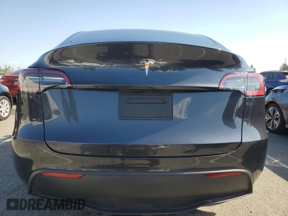 2024 Tesla Model Y with VIN 7SAYGDED7RF056973, listed as a Copart auction lot 55310705 with 15,391 mi miles and Salvage Title. Bid and sale history available at DreamBid. Image 6.