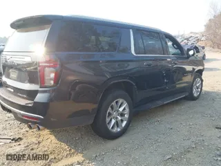 2023 Chevrolet Suburban Premier with VIN 1GNSKFKD4PR334079, listed as a IAAI auction lot 41657744 with 61,409 mi miles. Bid and sale history available at carsss.com. Image 4.