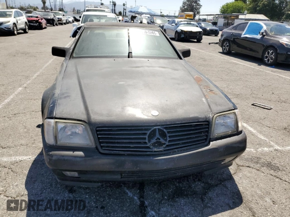 1992 Mercedes-Benz 500 z VIN WDBFA66E9NF050217, wystawiony jako Copart lot #58065965 z przebiegiem 143 456 mil mil oraz Tytuł czysty. Historia ofert i sprzedaży dostępna na DreamBid. Obrazek 5.