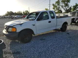 2004 Ford F-150 XL with VIN 2FTRX17W34CA46729, listed as a Copart auction lot 63187105 with 216,672 mi miles and Salvage title. Bid and sale history available at DreamBid. Image 1.