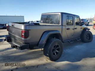 2021 Jeep Gladiator Rubicon с VIN 1C6JJTBM4ML594204, выставлен на аукционе Copart как лот 83998224 с пробегом 25 852 миль миль и Списание • Salvage title. История ставок и продаж доступна на DreamBid. Изображение 3.