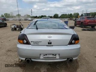 2003 Hyundai Tiburon z VIN KMHHM65D43U017995, wystawiony jako Copart lot #56498665 z przebiegiem 162 820 mil mil oraz Szkoda całkowita • Salvage title. Historia ofert i sprzedaży dostępna na DreamBid. Obrazek 6.