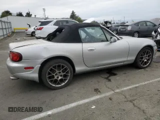 2004 Mazda MX-5 Miata LS with VIN JM1NB353440402453, listed as a Copart auction lot 45064475 with 151,508 mi miles and Salvage title. Bid and sale history available at DreamBid. Image 3.