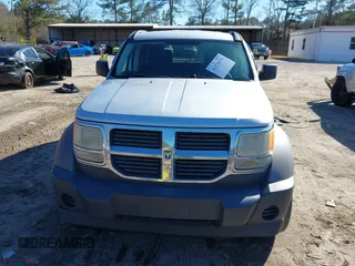 2007 Dodge Nitro SXT with VIN 1D8GT28K97W642118, listed as a IAAI auction lot 41276172 with 385,441 mi miles. Bid and sale history available at carsss.com. Image 12.