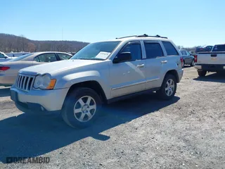 2010 Jeep Grand Cherokee Laredo with VIN 1J4PR4GK2AC125918, listed as a IAAI auction lot 41899078 with 236,229 mi miles. Bid and sale history available at carsss.com. Image 2.