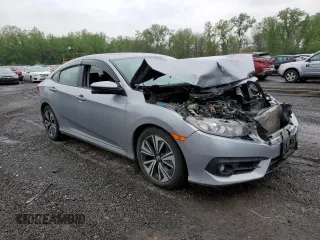 2017 Honda Civic EX-L z VIN 19XFC1F74HE209787, wystawiony jako Copart lot #56352415 z przebiegiem 130 264 mil mil oraz Szkoda całkowita • Salvage title. Historia ofert i sprzedaży dostępna na DreamBid. Obrazek 4.