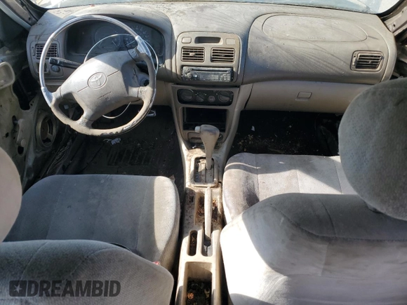 1998 Toyota Corolla VE with VIN 1NXBR12E3WZ093073, listed as a Copart auction lot 58270705 with 303,875 mi miles and Salvage title. Bid and sale history available at DreamBid. Image 8.
