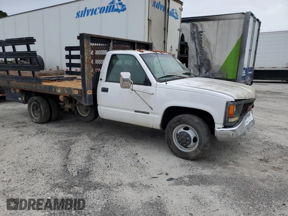 1999 GMC Sierra 1500 with VIN 1GDJC34R3XF087014, listed as a Copart auction lot 86367084 with 94,539 mi miles and Clean Title. Bid and sale history available at DreamBid. Image 4.