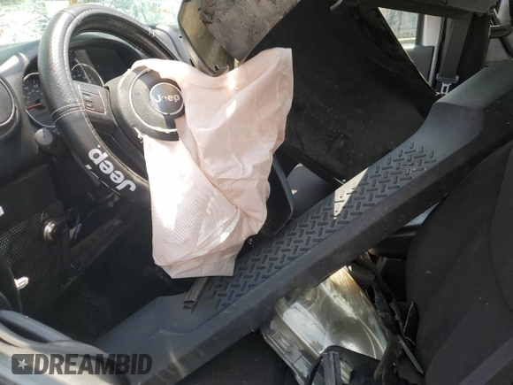 2013 Jeep Wrangler Sport with VIN 1C4AJWAG0DL696928, listed as a Copart auction lot 60822915 with 169,503 mi miles and Salvage title. Bid and sale history available at DreamBid. Image 7.