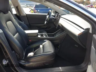 2019 Tesla Model 3 Mid Range with VIN 5YJ3E1EA2KF305834, listed as a IAAI auction lot 41719610 with 126,333 mi miles and . Bid and sale history available at DreamBid. Image 5.