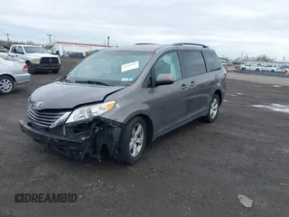 2015 Toyota Sienna LE AAS with VIN 5TDKK3DC1FS615090, listed as a IAAI auction lot 41965112 with 116,745 mi miles. Bid and sale history available at carsss.com. Image 2.